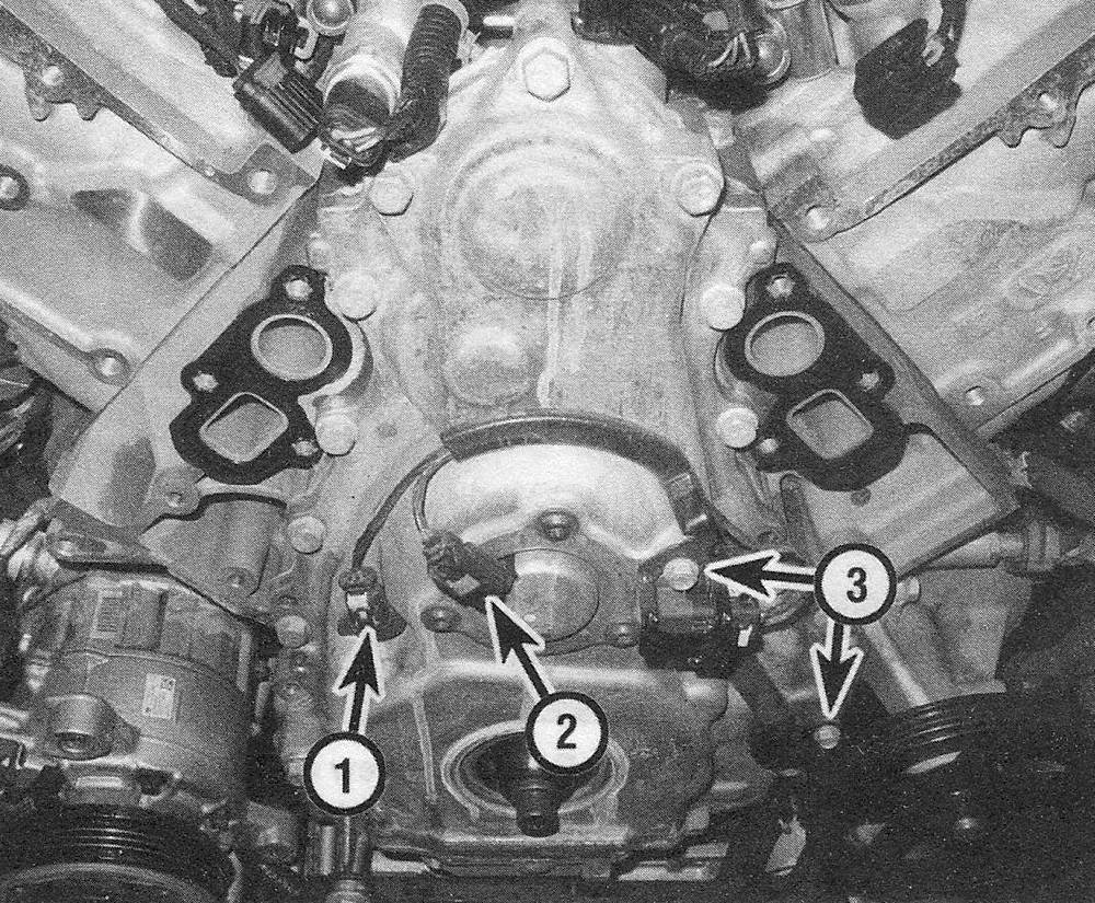 Chevrolet Silverado V6 engine 4,3L _ Disconnect the electrical connectors to the camshaft position sensor (1) and the camshaft position actuator magnet (2), then remove the wiring harness-to-cover bolts (3)